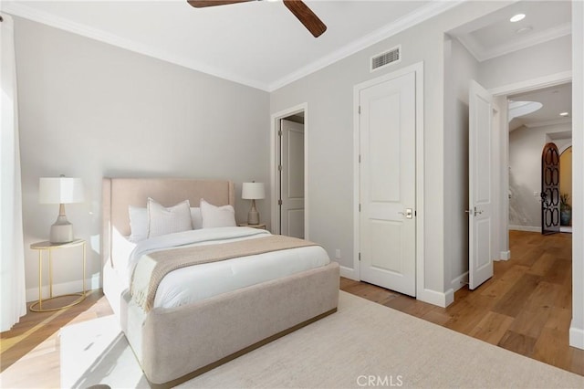25 Tenderfoot, Irvine, CA 92602 - bedroom featuring crown molding, wood finished floors, baseboards, and a ceiling fan