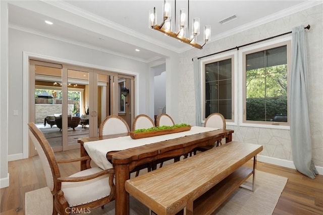 25 Tenderfoot, Irvine, CA 92602 - dining space with light wood-style flooring, crown molding, a chandelier, and recessed lighting