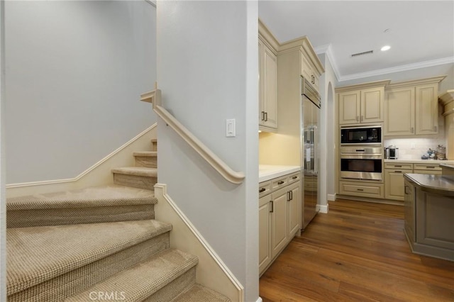 25 Tenderfoot, Irvine, CA 92602 - staircase with wood finished floors, ornamental molding, and recessed lighting