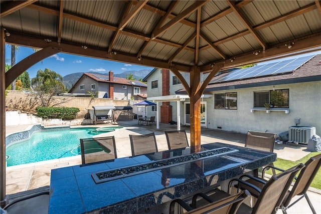 2247 Bella Ave, Upland, CA 91784 - view of patio featuring outdoor dining area, a fenced backyard, central AC unit, and a gazebo