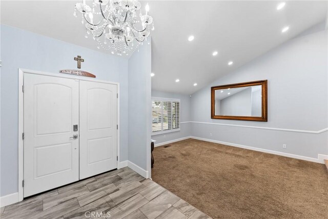 2247 Bella Ave, Upland, CA 91784 - carpeted entrance foyer with a chandelier, baseboards, recessed lighting, and vaulted ceiling