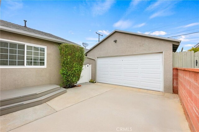 detached garage with fence