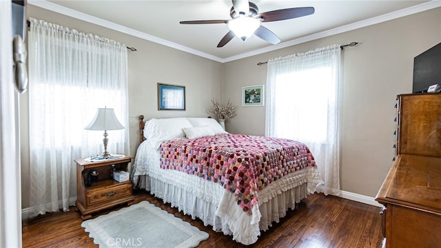 bedroom featuring wood finished floors, baseboards, crown molding, and ceiling fan