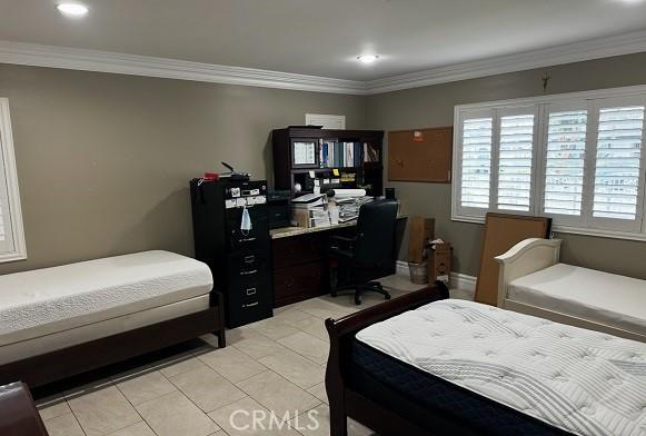 bedroom with ornamental molding, light tile patterned floors, recessed lighting, and a desk