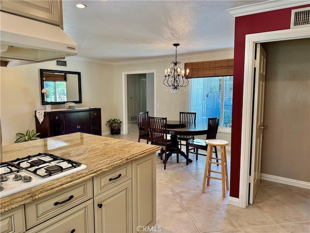 19020 Killoch Way, Porter Ranch, CA 91326 - kitchen featuring under cabinet range hood, white gas cooktop, healthy amount of natural light, a chandelier, and crown molding