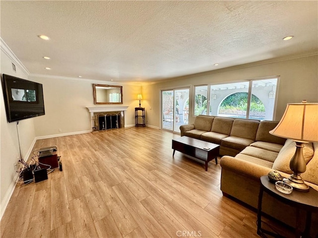 19020 Killoch Way, Porter Ranch, CA 91326 - living room featuring a textured ceiling, baseboards, recessed lighting, light wood finished floors, and crown molding