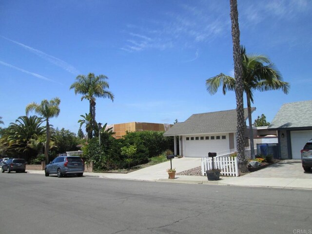 2640 Luciernaga St, Carlsbad, CA 92009 - view of front of property with fence and an attached garage