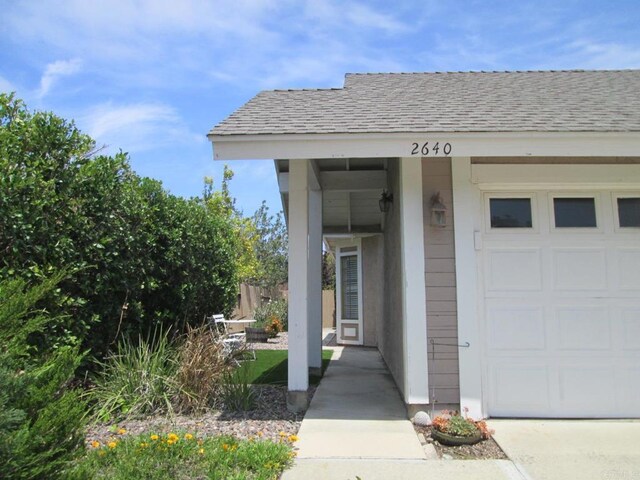 2640 Luciernaga St, Carlsbad, CA 92009 - entrance to property with a shingled roof and an attached garage