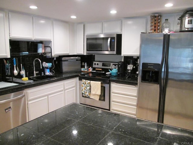 2640 Luciernaga St, Carlsbad, CA 92009 - kitchen featuring appliances with stainless steel finishes, white cabinets, tasteful backsplash, and recessed lighting