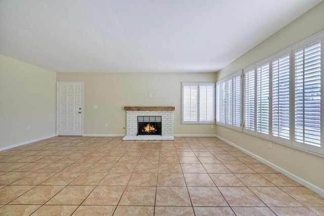 2640 Luciernaga St, Carlsbad, CA 92009 - unfurnished living room featuring light tile patterned flooring and a brick fireplace