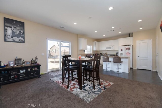 11952 Saxton Way, Victorville, CA 92392 - dining area with recessed lighting, dark carpet, and baseboards