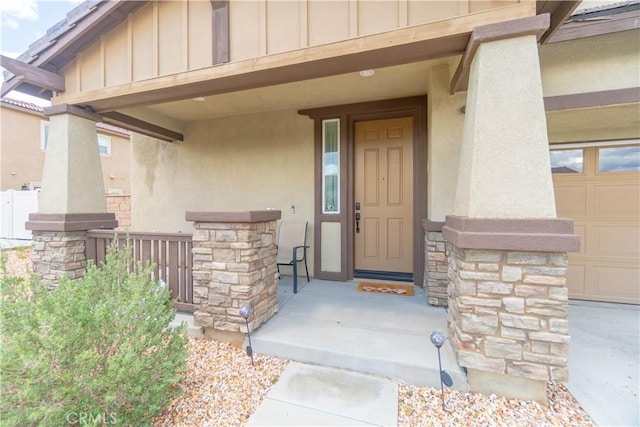 11952 Saxton Way, Victorville, CA 92392 - doorway to property with board and batten siding, stone siding, and stucco siding