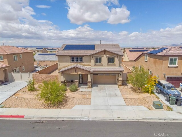 11952 Saxton Way, Victorville, CA 92392 - traditional-style home featuring a tile roof, a porch, stucco siding, solar panels, and concrete driveway