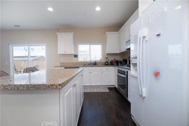 11952 Saxton Way, Victorville, CA 92392 - kitchen featuring white appliances, white cabinetry, dark wood-style floors, and recessed lighting