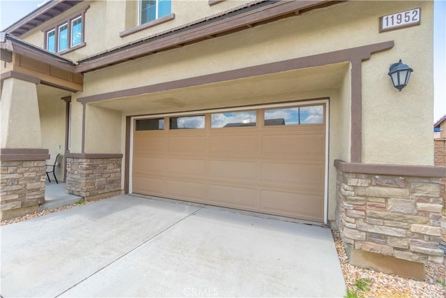 11952 Saxton Way, Victorville, CA 92392 - garage featuring concrete driveway