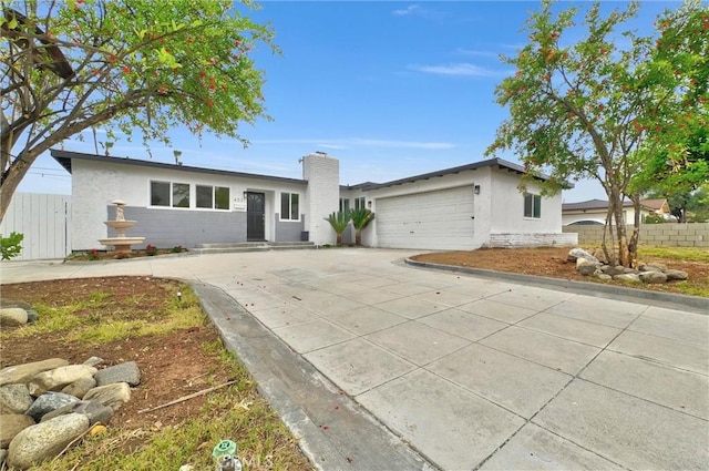 4531 N De Lay Ave, Covina, CA 91722 - ranch-style home featuring an attached garage, stucco siding, fence, and driveway