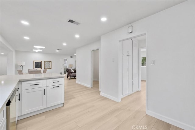 4531 N De Lay Ave, Covina, CA 91722 - kitchen featuring white cabinetry, light wood finished floors, light countertops, baseboards, and recessed lighting