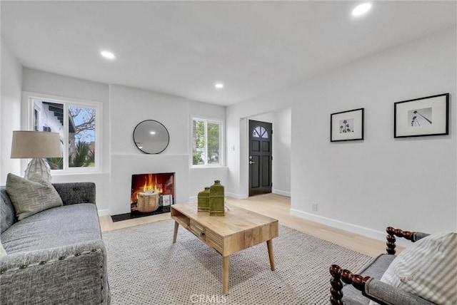 4531 N De Lay Ave, Covina, CA 91722 - living room with recessed lighting, light wood-style flooring, baseboards, and a fireplace with flush hearth