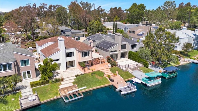 aerial view of residential area with a nearby body of water