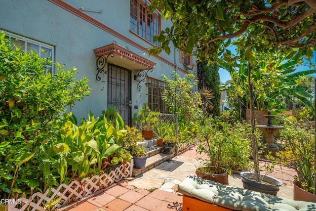 6154 Fountain Ave, Hollywood, CA 90028 - doorway to property featuring stucco siding and a patio area