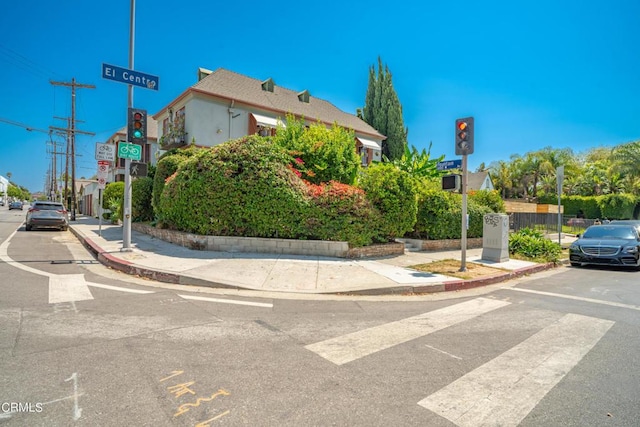 6154 Fountain Ave, Hollywood, CA 90028 - view of asphalt road with curbs, sidewalks, and traffic lights
