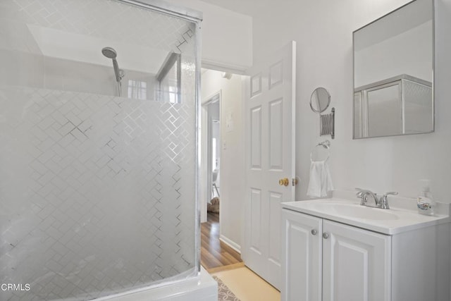 6154 Fountain Ave, Hollywood, CA 90028 - full bathroom featuring a shower stall, vanity, and wood finished floors