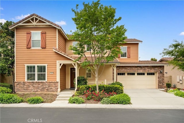 228 Wicker, Irvine, CA 92618 - view of front of property featuring brick siding, concrete driveway, and an attached garage