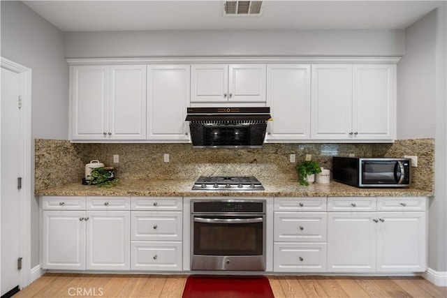 228 Wicker, Irvine, CA 92618 - kitchen with stainless steel appliances, tasteful backsplash, and white cabinets