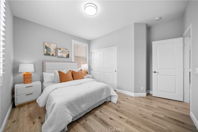 228 Wicker, Irvine, CA 92618 - bedroom with baseboards, light wood-style floors, and a closet