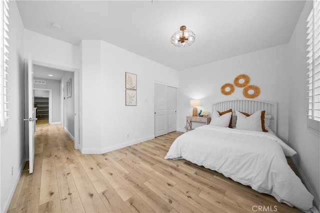 228 Wicker, Irvine, CA 92618 - bedroom with light wood-style flooring, baseboards, and a closet