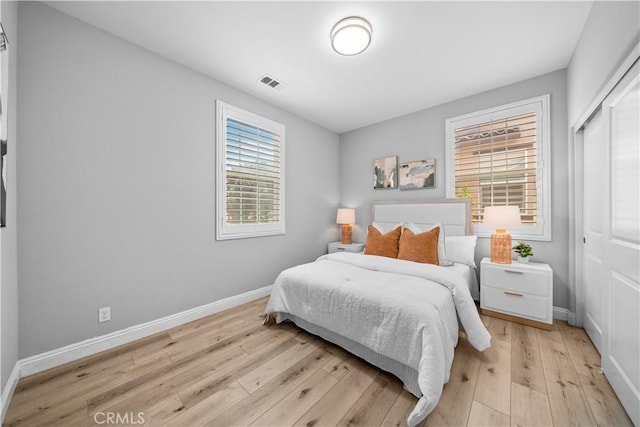 228 Wicker, Irvine, CA 92618 - bedroom featuring light wood finished floors, baseboards, and a closet