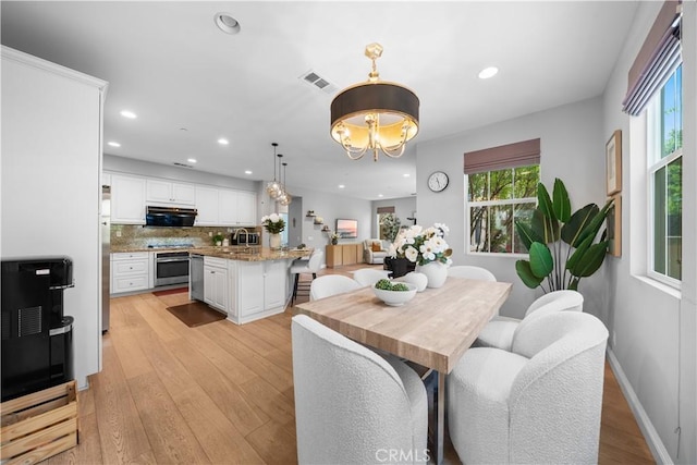228 Wicker, Irvine, CA 92618 - dining space featuring recessed lighting, light wood-type flooring, and a chandelier