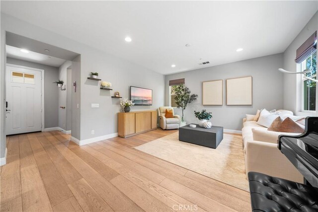 228 Wicker, Irvine, CA 92618 - living room with light wood-style floors, recessed lighting, and baseboards
