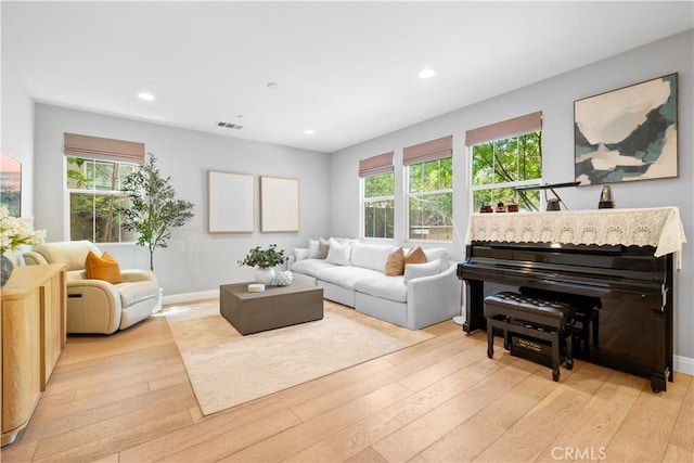 228 Wicker, Irvine, CA 92618 - living room with light wood finished floors, healthy amount of natural light, recessed lighting, and baseboards