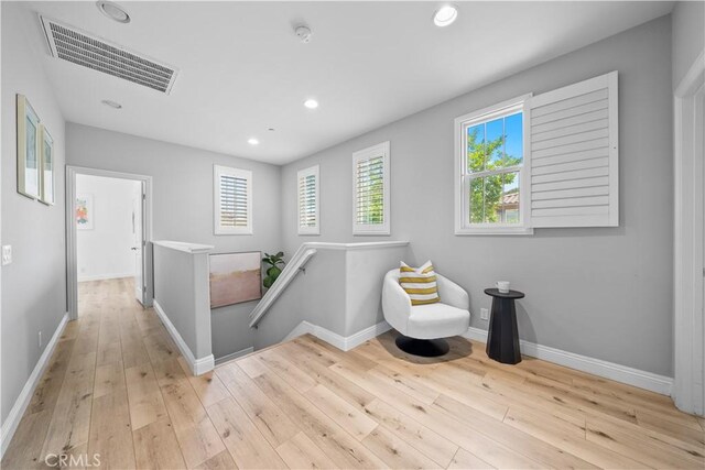 228 Wicker, Irvine, CA 92618 - sitting room featuring an upstairs landing, hardwood / wood-style floors, healthy amount of natural light, baseboards, and recessed lighting