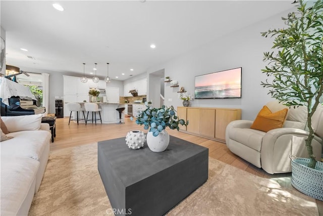 228 Wicker, Irvine, CA 92618 - living area featuring light wood-style flooring and recessed lighting