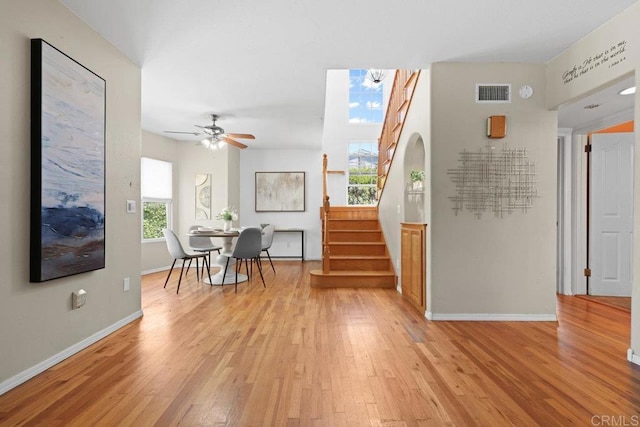 4625 68th St, La Mesa, CA 91942 - dining room with light wood-style flooring, baseboards, stairs, and ceiling fan