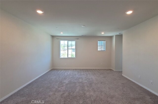 24295 Insignia Dr, Menifee, CA 92584 - spare room featuring recessed lighting, carpet floors, and baseboards