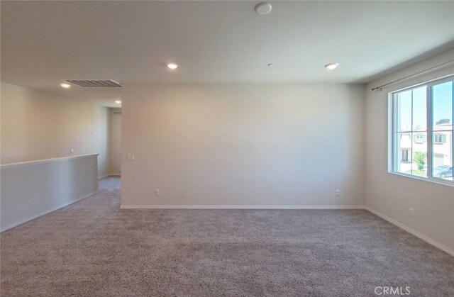 24295 Insignia Dr, Menifee, CA 92584 - carpeted empty room featuring recessed lighting and baseboards