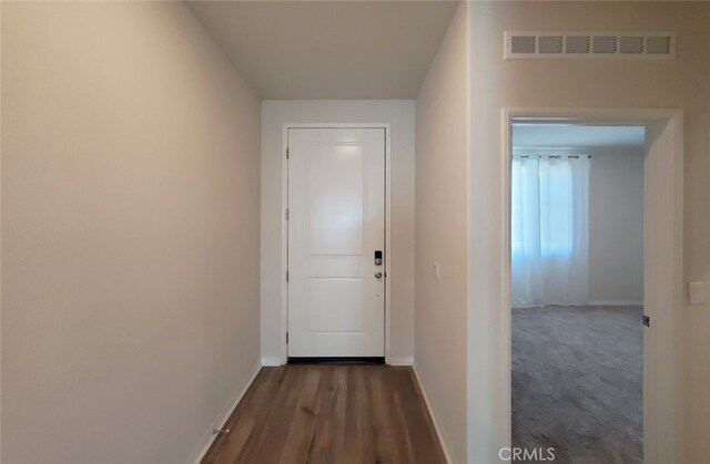 24295 Insignia Dr, Menifee, CA 92584 - corridor with baseboards and dark wood-type flooring