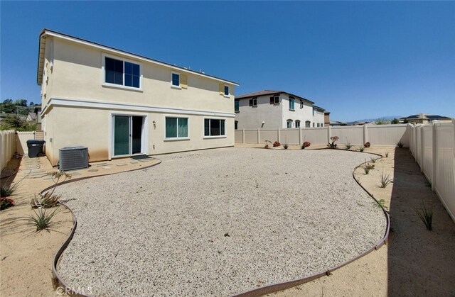 24295 Insignia Dr, Menifee, CA 92584 - rear view of property with stucco siding, a fenced backyard, and cooling unit
