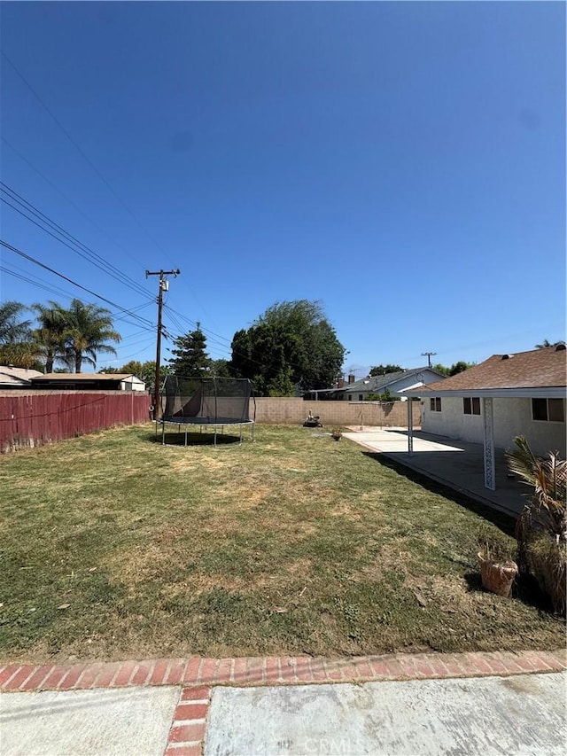 2126 S Fern Ave, Ontario, CA 91762 - view of yard featuring a trampoline and a patio area