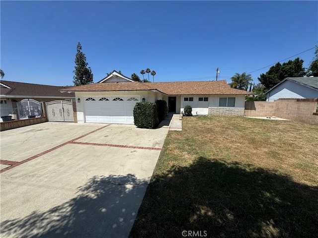 2126 S Fern Ave, Ontario, CA 91762 - ranch-style home with a garage, driveway, stucco siding, and a gate