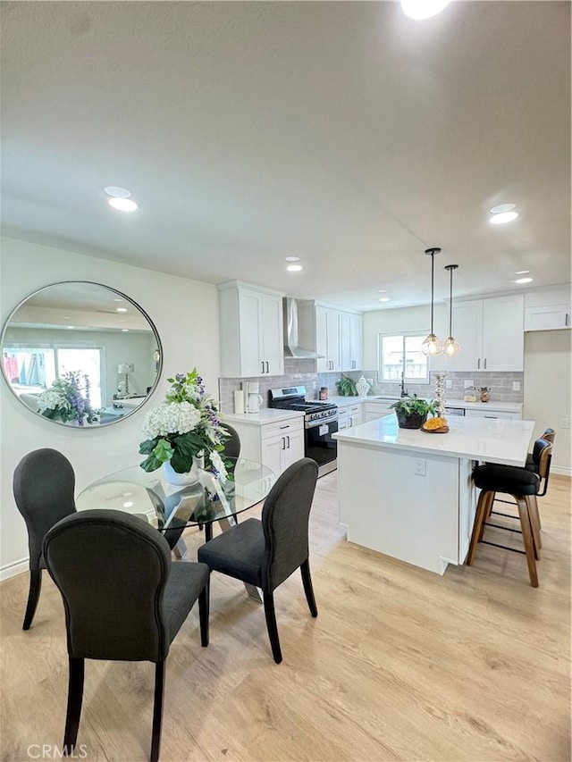 2126 S Fern Ave, Ontario, CA 91762 - dining space featuring light wood-style floors, recessed lighting, and baseboards