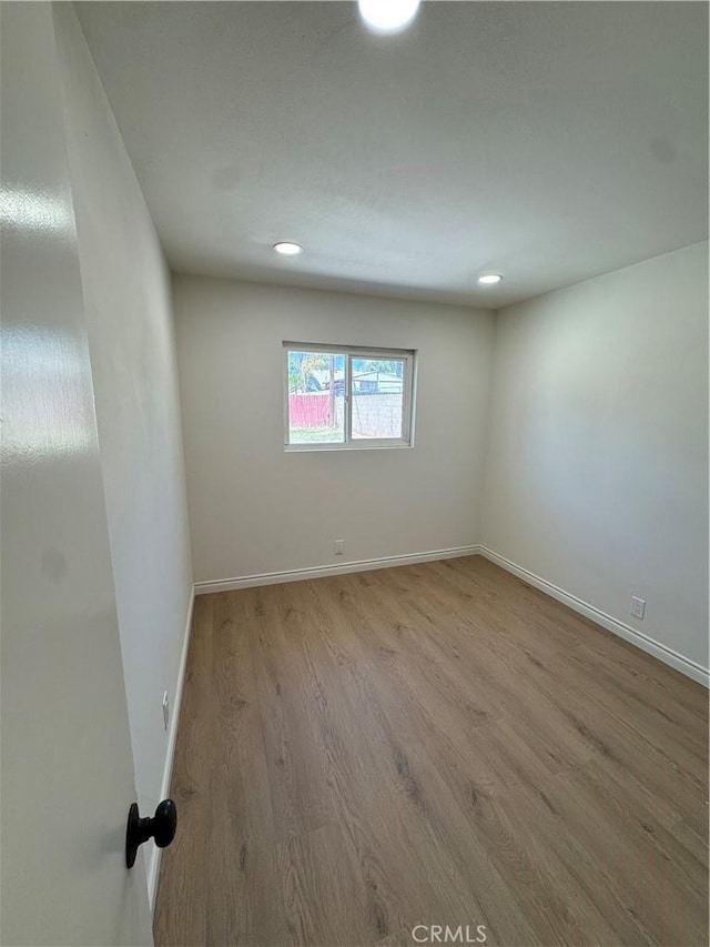 2126 S Fern Ave, Ontario, CA 91762 - unfurnished room with wood finished floors, baseboards, and recessed lighting