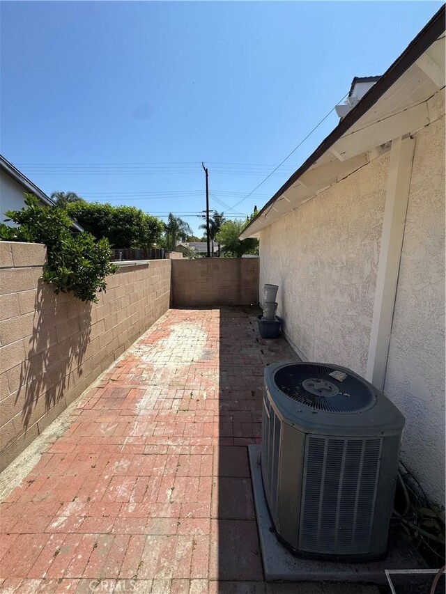 2126 S Fern Ave, Ontario, CA 91762 - view of patio featuring cooling unit and a fenced backyard