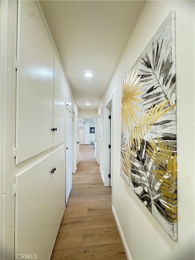 2126 S Fern Ave, Ontario, CA 91762 - hall featuring light wood-style floors, baseboards, and recessed lighting