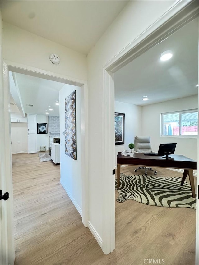 2126 S Fern Ave, Ontario, CA 91762 - hall with a desk, wood finished floors, baseboards, and recessed lighting