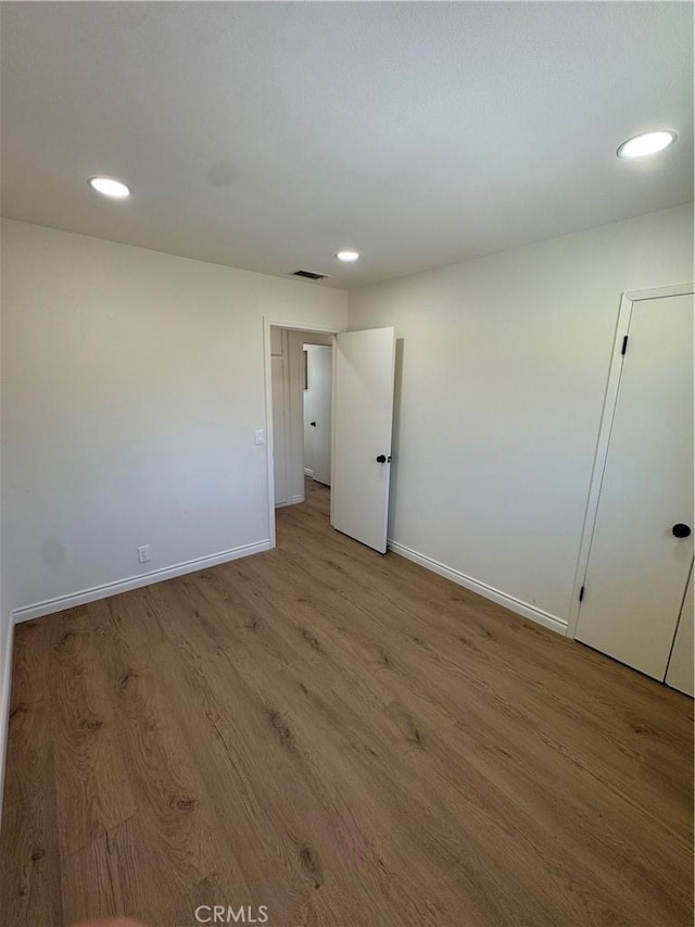 2126 S Fern Ave, Ontario, CA 91762 - empty room with baseboards, wood finished floors, and recessed lighting