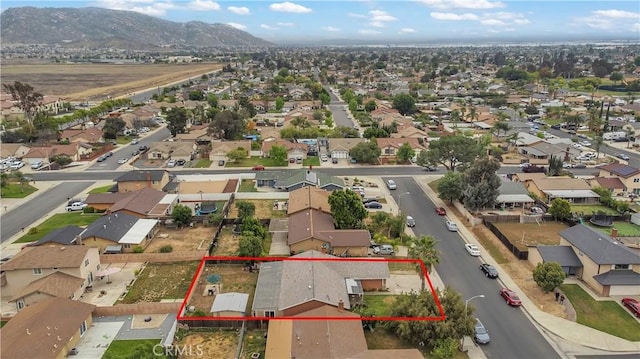 14328 Houston Dr, Moreno Valley, CA 92553 - aerial view of residential area featuring a mountain backdrop and property parcel outlined